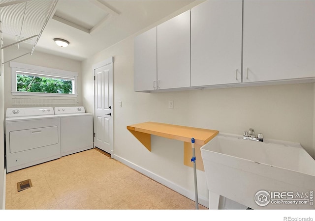 2226 Eagles Nest Dr, Lafayette, CO 80026 - laundry area featuring cabinet space, washer and clothes dryer, light flooring, and attic access