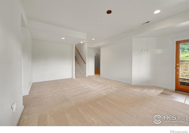 2226 Eagles Nest Dr, Lafayette, CO 80026 - empty room with light colored carpet, stairway, and recessed lighting