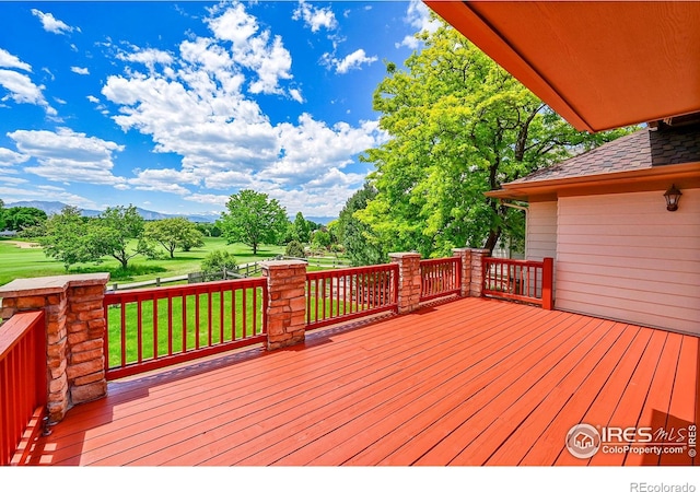 2226 Eagles Nest Dr, Lafayette, CO 80026 - wooden terrace with a lawn and a mountain view