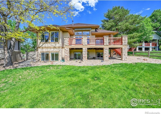 2226 Eagles Nest Dr, Lafayette, CO 80026 - rear view of house with a wooden deck, stairs, a yard, and stone siding