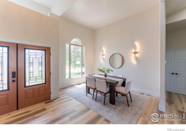 5217 Dry Creek Rd, Evans, CO 80634 - dining space featuring light wood-type flooring and baseboards
