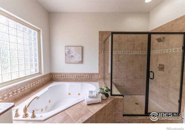 5217 Dry Creek Rd, Evans, CO 80634 - bathroom with a whirlpool tub and a stall shower