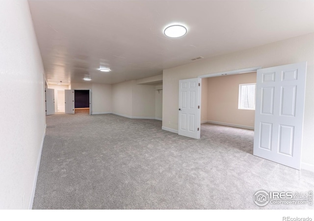 5217 Dry Creek Rd, Evans, CO 80634 - basement featuring carpet flooring and baseboards