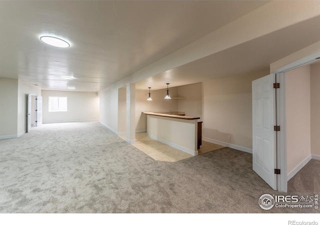 5217 Dry Creek Rd, Evans, CO 80634 - empty room featuring carpet floors and bar area
