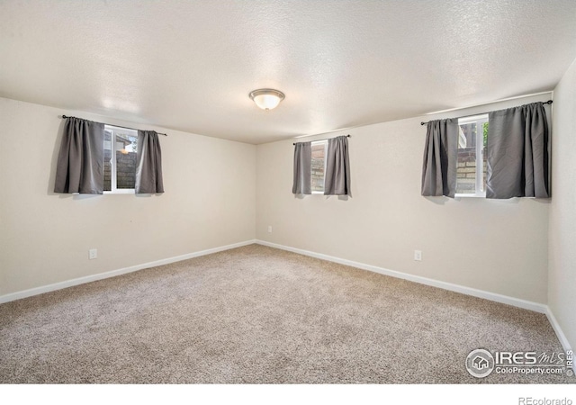556 Lincoln Ave, Nunn, CO 80648 - empty room with a textured ceiling and carpet flooring