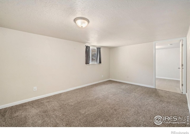 556 Lincoln Ave, Nunn, CO 80648 - carpeted spare room featuring a textured ceiling and baseboards