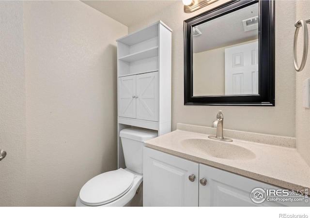 556 Lincoln Ave, Nunn, CO 80648 - half bathroom featuring vanity and toilet