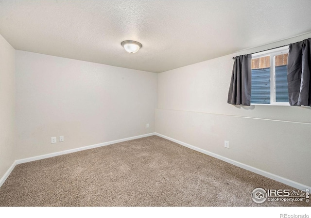 556 Lincoln Ave, Nunn, CO 80648 - spare room with carpet floors and a textured ceiling