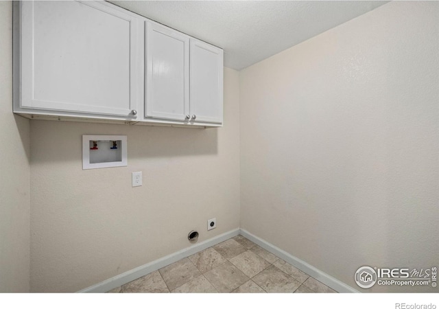556 Lincoln Ave, Nunn, CO 80648 - laundry area with cabinet space, washer hookup, and electric dryer hookup