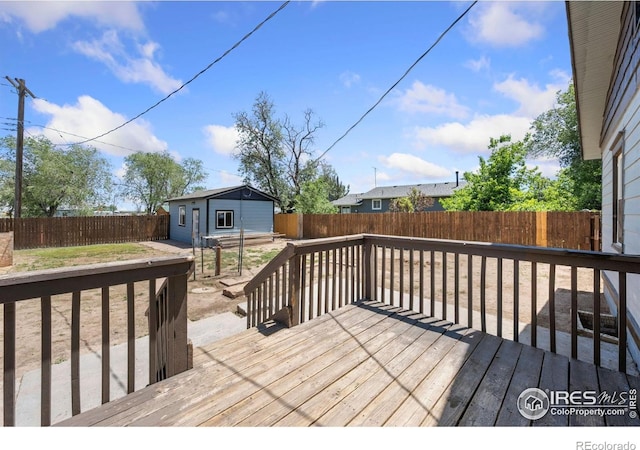 556 Lincoln Ave, Nunn, CO 80648 - wooden terrace featuring a fenced backyard and an outbuilding