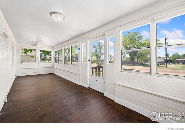 556 Lincoln Ave, Nunn, CO 80648 - unfurnished sunroom featuring wood finished floors and baseboards