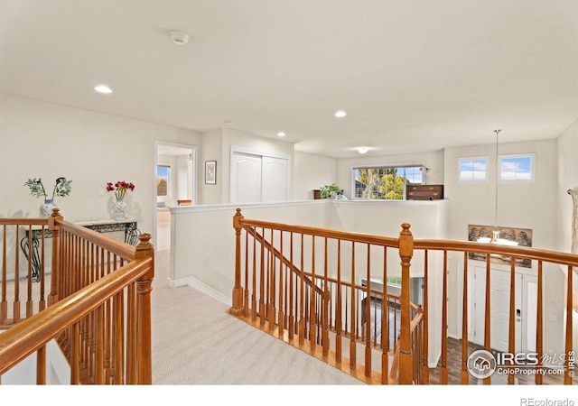 8383 Castaway Dr, Windsor, CO 80528 - hall with an upstairs landing, carpet, and recessed lighting