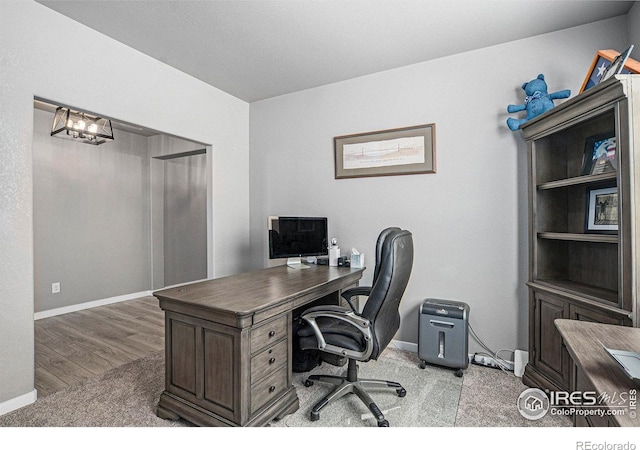 973 Mt Andrew Dr, Severance, CO 80550 - office with baseboards and a chandelier