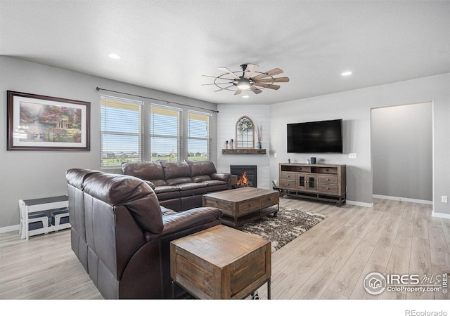 973 Mt Andrew Dr, Severance, CO 80550 - living area featuring ceiling fan, light wood-style flooring, a large fireplace, and recessed lighting