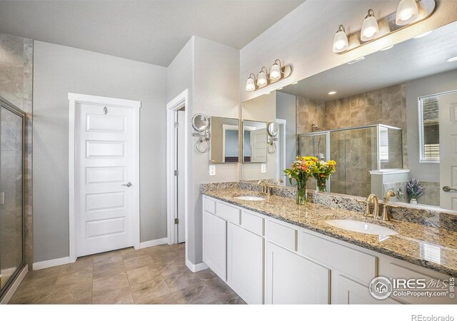 973 Mt Andrew Dr, Severance, CO 80550 - full bath featuring a stall shower and double vanity
