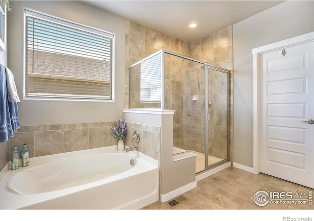 973 Mt Andrew Dr, Severance, CO 80550 - bathroom featuring a garden tub, a stall shower, tile patterned floors, and recessed lighting