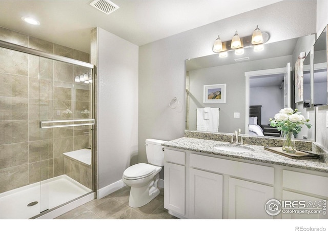 973 Mt Andrew Dr, Severance, CO 80550 - full bathroom featuring ensuite bathroom, a shower stall, vanity, and tile patterned floors