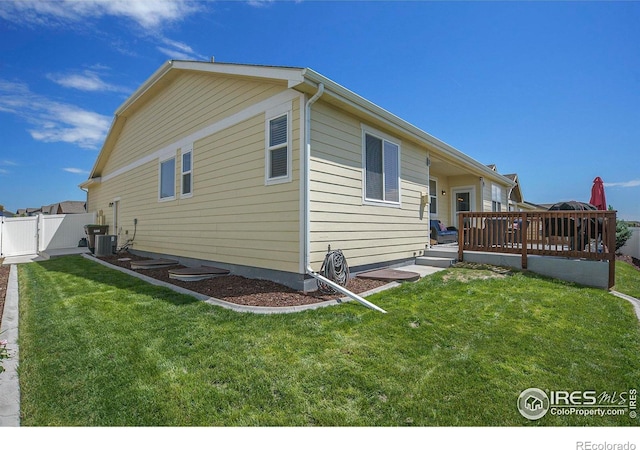 973 Mt Andrew Dr, Severance, CO 80550 - view of home's exterior featuring a wooden deck and a cooling unit