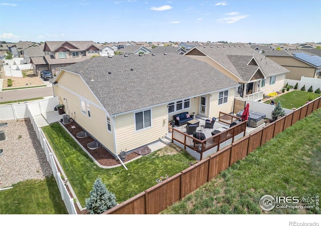 973 Mt Andrew Dr, Severance, CO 80550 - back of house featuring outdoor lounge area, a residential view, roof with shingles, and a fenced backyard