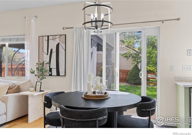 3826 Glenarbor Ln Unit F, Fort Collins, CO 80524 - dining space with a chandelier and light wood-style floors