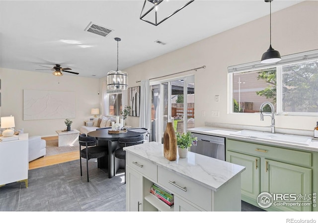 3826 Glenarbor Ln Unit F, Fort Collins, CO 80524 - kitchen with stainless steel dishwasher, open floor plan, green cabinetry, a ceiling fan, and hanging light fixtures