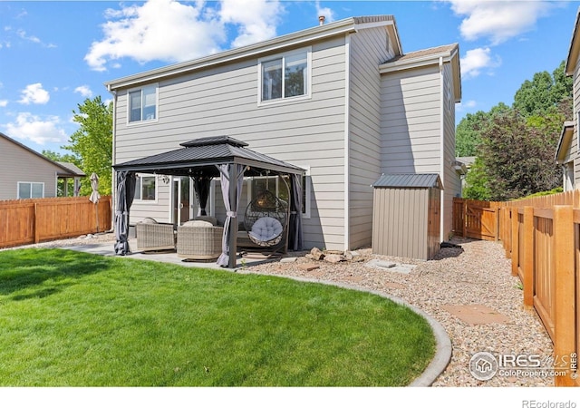 3826 Glenarbor Ln Unit F, Fort Collins, CO 80524 - back of property with a gazebo, an outdoor hangout area, a fenced backyard, and a patio area