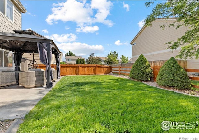 3826 Glenarbor Ln Unit F, Fort Collins, CO 80524 - fenced backyard featuring a gazebo and a patio