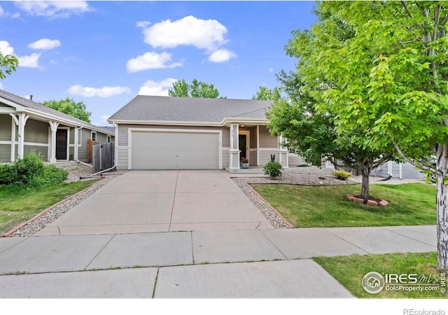858 Turpin Way, Erie, CO 80516 - view of front facade with an attached garage, a front yard, driveway, and covered porch