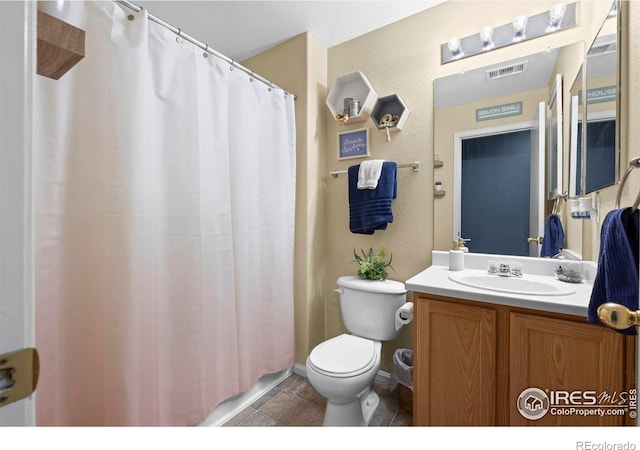 858 Turpin Way, Erie, CO 80516 - full bathroom with vanity, a textured wall, tile patterned flooring, and a shower with shower curtain