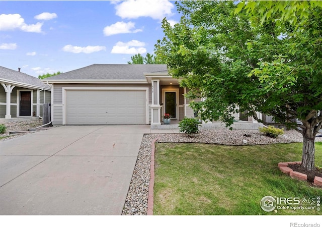 858 Turpin Way, Erie, CO 80516 - view of front of home with a garage, driveway, and a front lawn