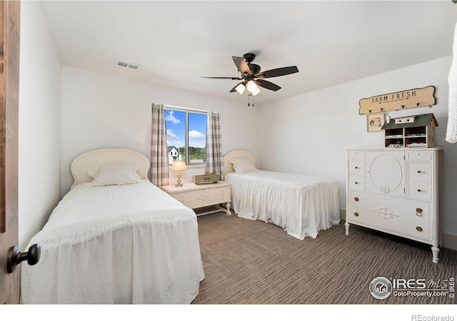 9260 Meadow Farms Dr, Milliken, CO 80543 - bedroom with dark carpet and ceiling fan