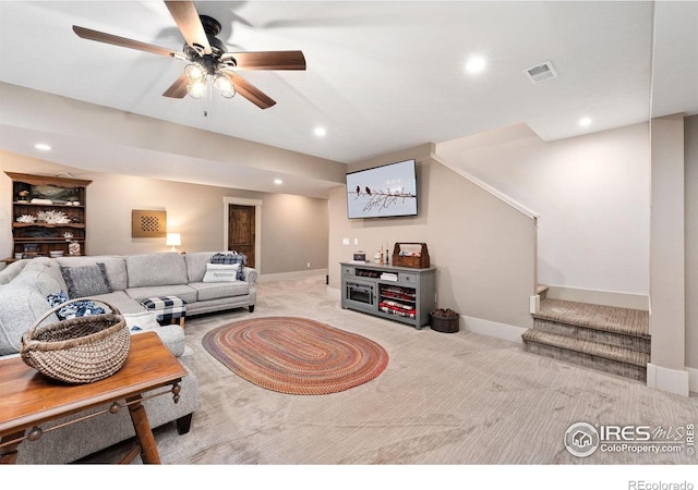 9260 Meadow Farms Dr, Milliken, CO 80543 - carpeted living room with stairway, recessed lighting, and a ceiling fan