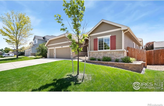 3664 Claycomb Ln, Johnstown, CO 80534 - view of front of property featuring brick siding, driveway, and an attached garage