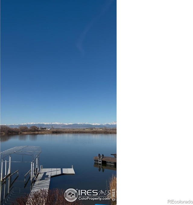 5763 Pelican Shores Dr, Longmont, CO 80504 - dock featuring a water and mountain view