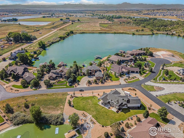 5763 Pelican Shores Dr, Longmont, CO 80504 - aerial view of property and surrounding area featuring a water and mountain view and nearby suburban area