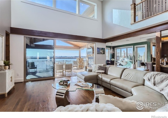 5763 Pelican Shores Dr, Longmont, CO 80504 - living area featuring hardwood / wood-style flooring and a towering ceiling