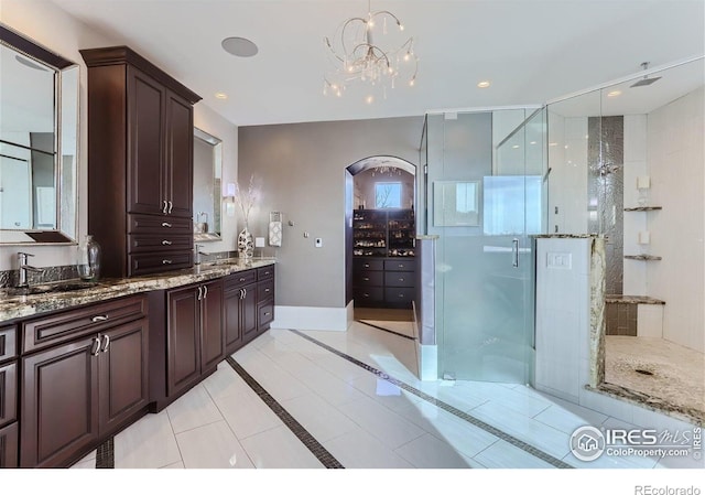 5763 Pelican Shores Dr, Longmont, CO 80504 - full bath with a stall shower, vanity, a chandelier, tile patterned flooring, and recessed lighting