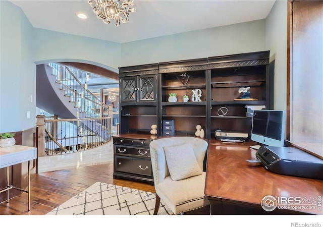 5763 Pelican Shores Dr, Longmont, CO 80504 - office area featuring hardwood / wood-style flooring, arched walkways, a chandelier, and recessed lighting
