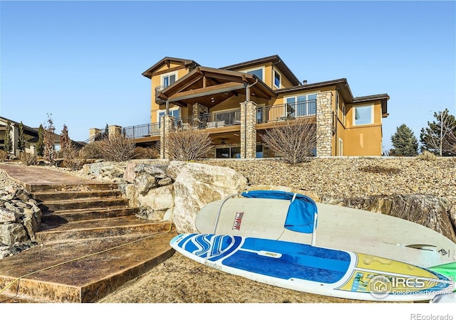 5763 Pelican Shores Dr, Longmont, CO 80504 - view of front of property featuring stucco siding and a balcony
