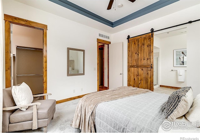 5457 Wishing Well Dr, Timnath, CO 80547 - bedroom with a barn door, light carpet, and a ceiling fan