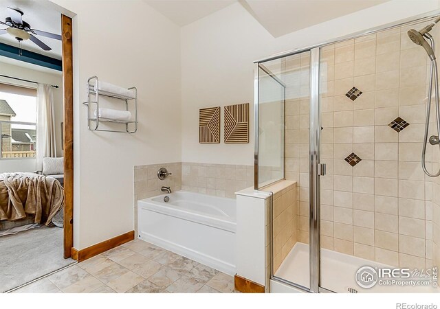 5457 Wishing Well Dr, Timnath, CO 80547 - full bath with ensuite bath, a bath, a shower stall, and a ceiling fan