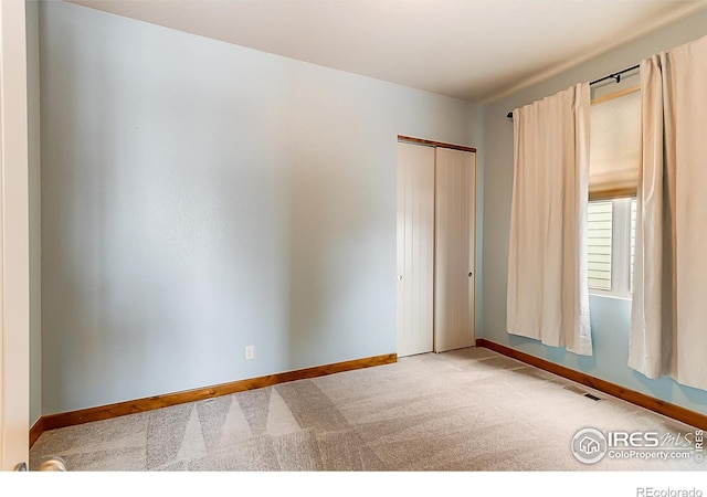 5457 Wishing Well Dr, Timnath, CO 80547 - unfurnished bedroom with carpet flooring and a closet