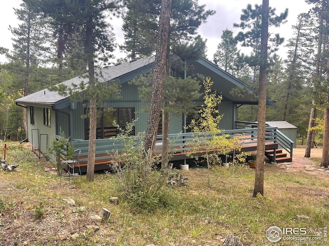 33 N Skinner Rd, Allenspark, CO 80510 - view of front of house featuring a deck and a shingled roof