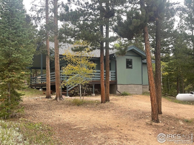 33 N Skinner Rd, Allenspark, CO 80510 - rear view of property with a wooden deck