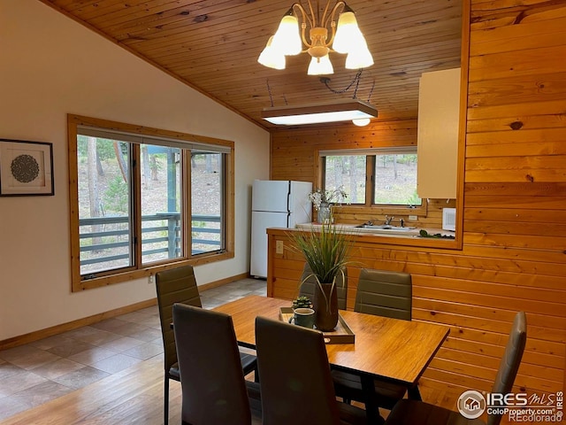 33 N Skinner Rd, Allenspark, CO 80510 - dining area with a chandelier, vaulted ceiling, and wooden ceiling