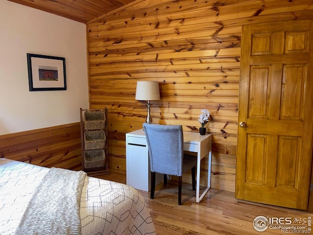 33 N Skinner Rd, Allenspark, CO 80510 - bedroom featuring wood ceiling, wooden walls, light wood-style flooring, and lofted ceiling