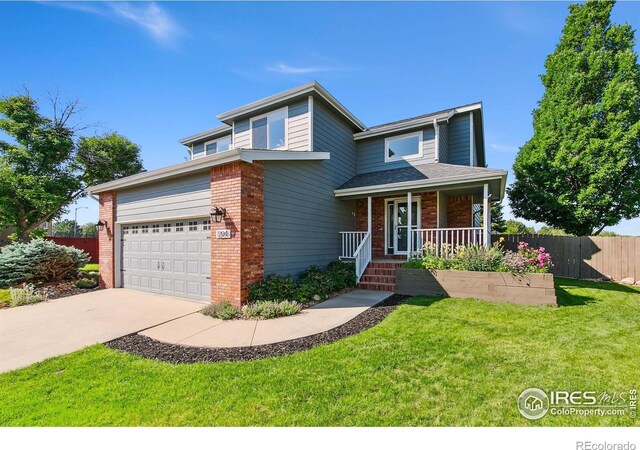 1204 Boulder Ct, Windsor, CO 80550 - traditional home featuring brick siding, covered porch, driveway, and a garage