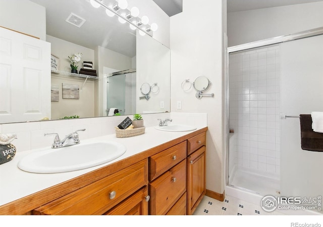 1204 Boulder Ct, Windsor, CO 80550 - bathroom with a stall shower and double vanity