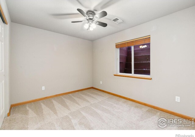 1204 Boulder Ct, Windsor, CO 80550 - carpeted spare room with baseboards and a ceiling fan