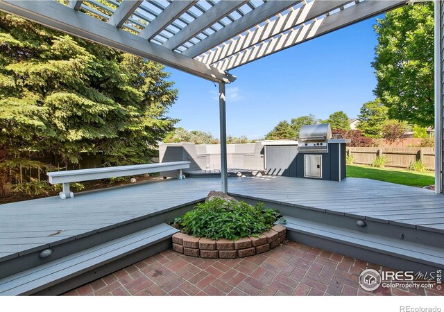 1204 Boulder Ct, Windsor, CO 80550 - view of patio featuring a pergola, a deck, and an outdoor kitchen